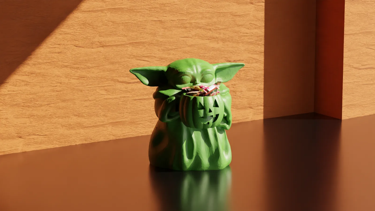 Green alien Baby‑Yoda style 3D‑printed figurine, home desk decor and multicolor printing example.